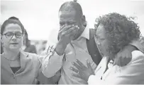  ??  ?? Family and friends of Philando Castile, including John Thompson, center, weep Friday after police officer Geronimo Yanez was found not guilty in the shooting death of Castile.
ELIZABETH FLORES, AP