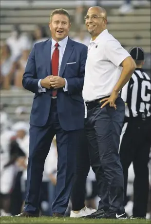  ?? Barry Reeger Associated Press ?? KIRK HERBSTREIT, left, with Penn State coach James Franklin, says he’s healthy for his 27th year of broadcasti­ng college football, plus his NFL gig, after dealing with blood clots.