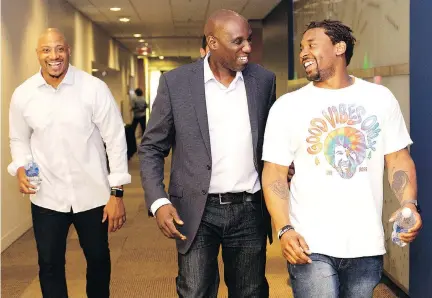  ?? ALLEN McINNIS ?? Alouettes general manger Kavis Reed, centre, with players John Bowman, left, and Tyrell Sutton, met with a group of season-ticket holders on Friday. “Our fans deserve to have a better team,” Reed said. “We feel strongly we’re going to make that happen.”