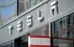  ?? Saul Loeb / Getty Images ?? The Tesla logo is seen outside of a company showroom.