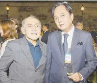  ?? ?? BSP Monetary Board member Romeo Bernardo and Ayala Land chief finance officer and treasurer Augusto Bengzon exchange ideas during the windy evening.