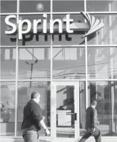  ??  ?? SAUGUS: In this photo Oct. 26, 2009 file photo, customers enter a Sprint store in Saugus, Mass. Sprint is introducin­g an ‘all-in’ pricing plan, meaning a single, $80-a-month price that includes both a smartphone and a service plan for voice, text and...