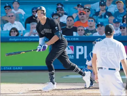  ?? MARK J. TERRILL/AP ?? The Yankees’ Aaron Judge follows through after hitting a solo home run in the third inning off the Dodgers’ Clayton Kershaw on Sunday.