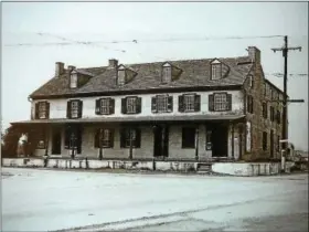  ?? SUBMITTED PHOTO ?? The Swamp Tavern, believed to have been built in 1757, stood on the corner of North Charlotte Street and Swamp Pike, where a Wawa now stands.