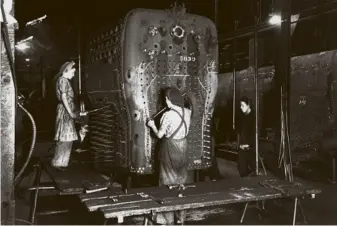  ??  ?? During the war years women took on a selection of tasks – here riveting a fire-box