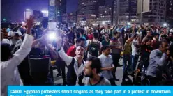  ?? — AFP ?? CAIRO: Egyptian protesters shout slogans as they take part in a protest in downtown Cairo on Friday.