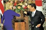  ?? From top ?? Giving a speech on Internatio­nal Women’s Day last year; bumping elbows with Japanese Foreign Minister Toshimitsu Motegi in Tokyo last October