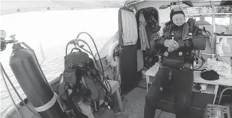  ?? CRIS KOHL ?? Technical diver Ken Merryman prepares his equipment for a deep dive in Georgian Bay. He and Windsor’s Cris Kohl became the first divers to visit the wreck of the J. H. Jones.