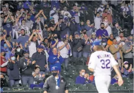  ?? ARMANDO L. SANCHEZ / CHICAGO TRIBUNE ?? Fans applaud Cubs starting pitcher Trevor Williams as he walks to the dugout during the seventh inning Monday.