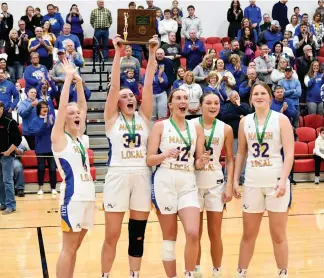  ?? Staff Photo/John Zwez ?? Marion Local seniors Jenna Knapke, Lindsey Koenig, Stella Huelsman, Hanna Rose, and Allison Everman celebrate after the Lady Flyers defeated Minster for the district title on Saturday at Wapakoneta.