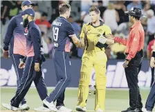  ??  ?? Australia’s Tim Paine shakes hands with Chris Woakes at the end.