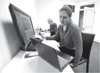  ??  ?? Xenia Mathys, a sophomore at CU, teaches music to Syrian refugees via Skype from the Boulder headquarte­rs of the refugee advocacy organizati­on Humanwire. Jeremy Papasso, Daily Camera