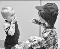  ??  ?? Harrison, 5, who is autistic, plays with Kaspar (right) at the University of Hertfordsh­ire in Stevenage, Britain. — Reuters photo