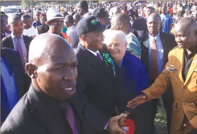  ??  ?? Vice President General Constantin­o Chiwenga (Retired) is welcomed by Muzvezve legislator Cde Peter Haritatos at Chakari Stadium yesterday