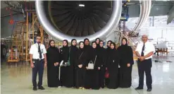  ??  ?? Khalifa University students beside an Airbus A380 engine at the Etihad Airways Engineerin­g hangar.