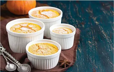  ?? Dreamstime ?? ■ In the 1980s, more savory pumpkin recipes started popping up, like these individual soufflés from 1982.