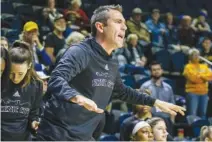  ?? STAFF PHOTO BY OLIVIA ROSS ?? UTC's Coach Shawn Poppie yells from the sidelines Jan. 12. UT Chattanoog­a women's basketball team took on Samford at home.