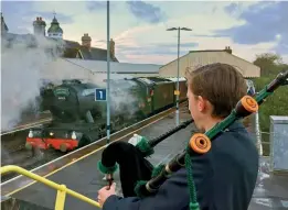  ?? DR C M BROWN ?? Swanage Railway Sygnet Frederick Sills pipes a farewell to Flying Scotsman as it leaves Wareham on November 8 following its latest visit to the Purbeck line.