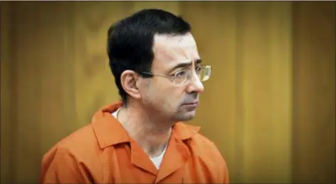  ?? MATTHEW DAE SMITH — LANSING STATE JOURNAL VIA AP, FILE ?? In this file photo, Larry Nassar, former sports doctor who admitted molesting some of the nation’s top gymnasts, appears in Eaton County Court in Charlotte, Mich. Numerous people have been criminally charged, fired or forced out of jobs in the wake of the scandal involving once-renowned gymnastics doctor, Nassar, who is serving decades in prison for molesting athletes and for child pornograph­y crimes.