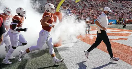  ?? Chuck Burton / Associated Press ?? Tom Herman led Texas to a 6-3 record this season, but it was also the 11th straight year the Longhorns didn’t win the Big 12 crown.