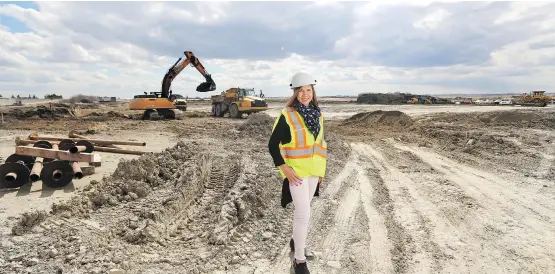  ?? GAVIN YOUNG ?? Sundial spokespers­on Claire Buffone-Blair, at the constructi­on site of the company’s new 500,000-square-foot cannabis facility in Olds on Tuesday.