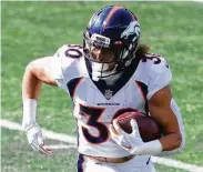  ?? Maddie Meyer / Getty Images ?? Phillip Lindsay, a two-time 1,000-yard rusher for Denver, gives the Texans younger legs at running back.