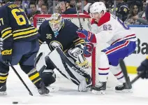  ?? JEFFREY T. BARNES/THE ASSOCIATED PRESS ?? Sabres goalie Linus Ullmark stops Habs forward Artturi Lehkonen during the first period Friday in Buffalo. Lehkonen scored what would be the game-winner in the second.