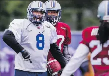  ?? DARIO AYALA/ MONTREAL GAZETTE ?? Former Stamps receiver Nik Lewis, left, takes part in the Montreal Alouettes training camp in Lennoxvill­e, Que.