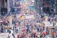  ?? CHRISTOPH SOEDER/DPA ?? Thousands march along the Friedrichs­trasse during the demonstrat­ion against coronaviru­s measures in Berlin on Saturday.