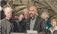  ?? | ERIN BROWN/ SUN- TIMES ?? Rev. Gary Graf, pastor at St. Procopius Parish, speaks at a press conference supporting Dreamers.