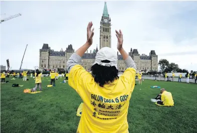  ?? JUSTIN TANG / THE CANADIAN PRESS FILES ?? Members of Falun Gong rally on Parliament Hill during a visit of China’s Premier Li Keqiang in 2016. The religious group has been targeted by what appears to be a Chinese government smear campaign in Canada.