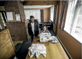  ??  ?? Shenenas Norbasha and her husband Mohammed Norbasha, with the sewing machine Red Cross volunteer Esmee Rowden found for the family.