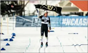  ?? CU ATHLETICS ?? Colorado’s Magnus Boee waves a CU flag as he crosses the finish line to win the national title in the men’s 20K Nordic classical race at the NCAA skiing championsh­ips on Saturday at Howelsen Hill in Steamboat Springs.