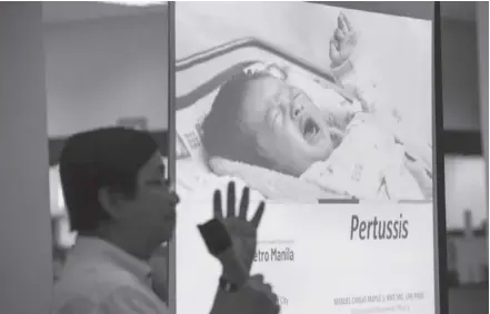  ?? ?? The Department of Health (DOH) is calling on local government­s to conduct “catch-up vaccinatio­n” drives especially for children to help prevent the spread of pertussis, a subject of a DOH informatio­n drive shown here in San Juan City, Metro Manila.