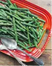  ??  ?? Crisp-tender green beans are tossed in a honey, Creole-mustard vinaigrett­e.