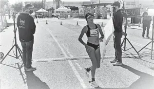  ?? GLAE THIEN ?? Women’s 20K race walk winner Celina Lepe takes a breath after crossing the finish line in Santee.