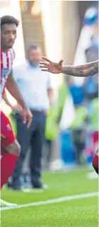  ?? ?? Daniel Phillips shrugs off the challenge of Rangers defender James Tavernier.