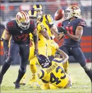  ?? Scott Strazzante / The Chronicle ?? The 49ers’ Raheem Mostert recovers an onside kick against the Rams at Levi’s Stadium in Santa Clara, Calif.