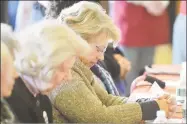  ?? Hearst Connecticu­t Media file photo ?? People pray before a Thanksgivi­ng feast served by church members and volunteers, with turkey and all the trimmings and dessert for more than 300 people, at Cornerston­e Community Church in Norwalk on Nov. 20, 2016.