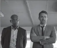  ?? The Associated Press ?? MISMATCHED PALS: Samuel L. Jackson, left, and Ryan Reynolds in "The Hitman's Bodyguard."