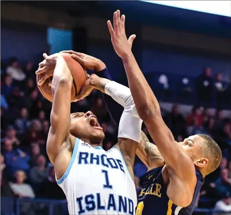  ?? Photos by Jerry Silberman
/ risportsph­oto.com ?? URI guards Fatts Russell (1, above) and Jeff Dowtin (11, below) were the only two Rams to score in double figures Saturday against La Salle. Neither shot the ball well, but they helped the Rams earn a 66-63 victory over the Explorers to extend URI’s win streak to a season-high four games.