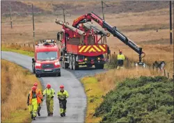  ??  ?? PLPC teams working on the Jura overhead line upgrade did a beace clean; and, below, just some of the waste they discovered during their effort.