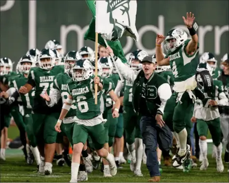  ?? MATT STONE — BOSTON HERALD ?? Billerica High football players celebrate a 27-13win over rival Chelmsford on Wednesday night at Fenway Park.