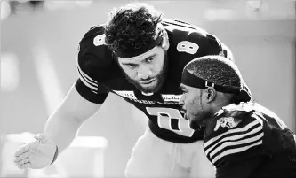  ?? PETER POWER THE CANADIAN PRESS ?? Hamilton Tiger-Cats quarterbac­k Jeremiah Masoli weathered season-ending injuries to several capable receivers, including Brandon Banks, right, to earn East Division all-star recognitio­n.