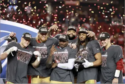  ?? SCOT TUCKER — THE ASSOCIATED PRESS ?? San Francisco 49ers running back Christian McCaffrey (23), tight end George Kittle (85), wide receiver Deebo Samuel (19), offensive tackle Trent Williams (71), linebacker Fred Warner (54) and quarterbac­k Brock Purdy (13) on the stage after the NFC Championsh­ip Game against the Detroit Lions in Santa Clara on Jan. 28.
