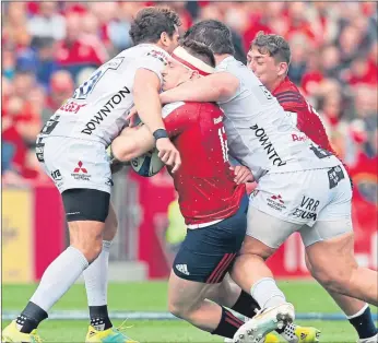  ??  ?? Gloucester’s Danny Cipriani (left) tackles Munster’s Rory Scannell, resulting in a red card for the Englishman