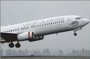  ?? (Bloomberg/Brendon Thorne) ?? A Boeing Co. 737 aircraft operated by Virgin Australia Holdings Ltd. takes off from Sydney Airport in Sydney, Australia, in early March.