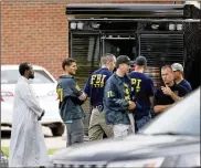  ?? DAVID JOLES / STAR TRIBUNE ?? Law enforcemen­t officials investigat­e an explosion at the Dar Al-Farooq Islamic Center in Bloomingto­n, Minn., on Saturday. Rewards have been posted for informatio­n leading to an arrest in the blast.