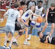  ?? Barbara hall ?? Calhoun senior forward Mac McDaniel looks for a nearby teammate to pass the ball too after securing a rebound against Southeast Whitfield.