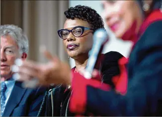  ?? STEVE SCHAEFER / SPECIAL TO THE AJC ?? Bernice King listens Wednesday to Xernona Clayton talk about her father during a panel discussion, which honored the 50-year anniversar­y of Dr. Martin Luther King’s assassinat­ion, at the Atlanta History Center’s McElreath Hall in Atlanta.